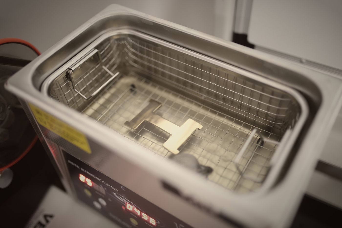 Ultrasonic cleaning for hardware